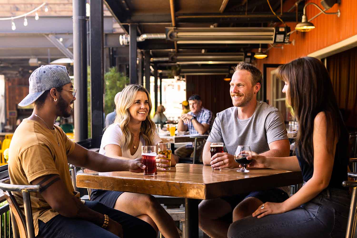 Group of people sitting around a table at the Brewery