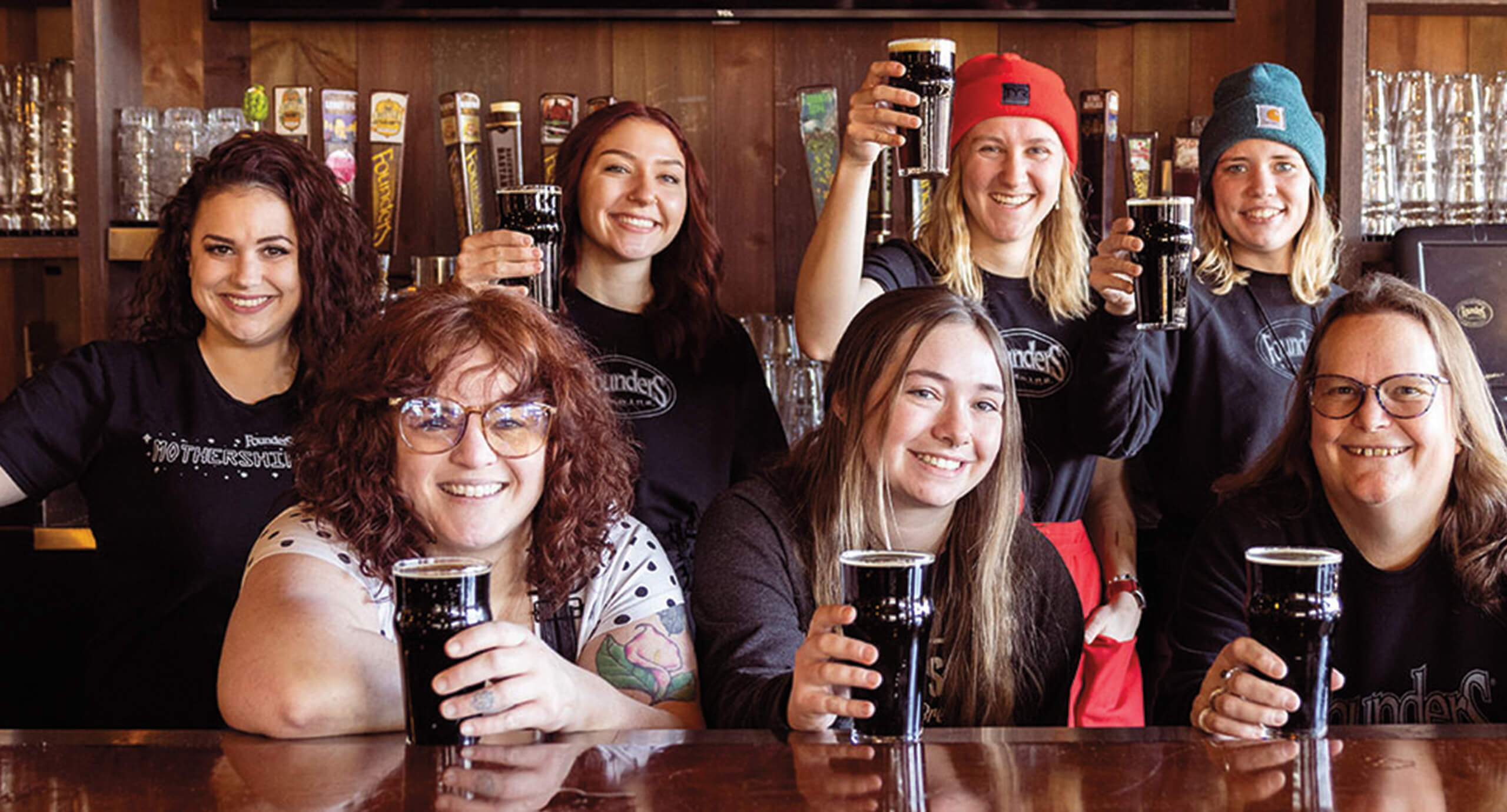 Group of Founders employees with beers